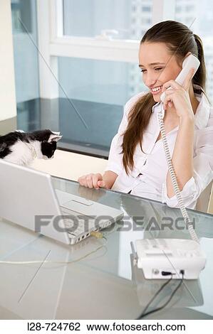 business woman using computer and telephone View Large Photo Image Stock Image - business woman using computer and telephone. Fotosearch