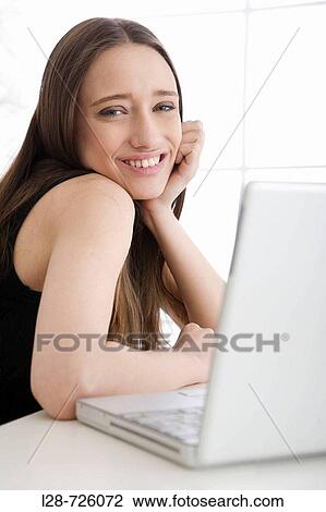business woman using computer, smiling View Large Photo Image Stock Image - business woman using computer, smiling. Fotosearch