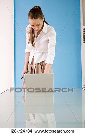 business woman using laptop View Large Photo Image Picture - business woman using laptop. Fotosearch