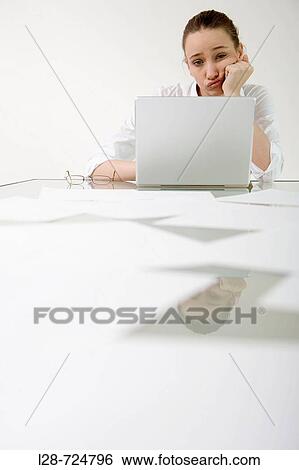 Stock Photograph - business woman using laptop. Fotosearch