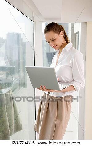 BUSINESS WOMAN USING LAPTOP View Large Photo Image Stock Photography - BUSINESS WOMAN USING LAPTOP. Fotosearch