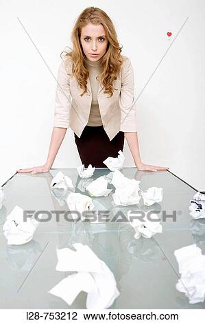 Stock Image - business woman waste paper. Fotosearch