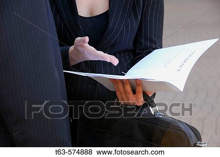 business woman with business man holding file and briefcase View Large Photo Image Stock Photo - business woman with business man holding file and briefcase. Fotosearch