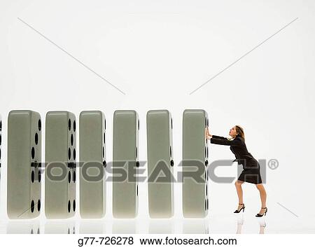 Business woman with domino View Large Photo Image Stock Photo - Business woman with domino. Fotosearch