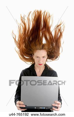 Business woman with laptop and high red hair View Large Photo Image Stock Image - Business woman with laptop and high red hair. Fotosearch