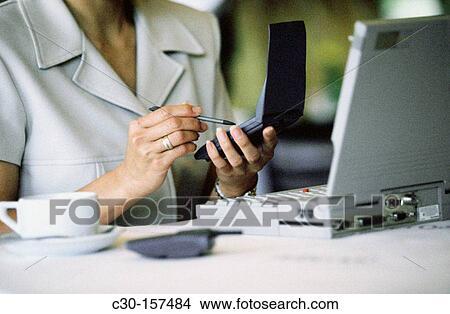 Business woman with portable electronic tools View Large Photo Image Picture - Business woman with portable electronic tools. Fotosearch