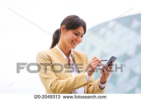 Business woman with smartphone business center. San Sebastian Technology Park. Donostia. Gipuzkoa. Basque Country. Spain. View Large Photo Image Stock Image - Business woman with smartphone business center. San Sebastian Technology Park. Donostia. Gipuzkoa. Basque Country. Spain.. Fotosearch