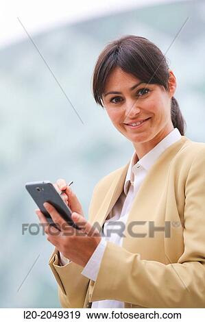 Business woman with smartphone business center. San Sebastian Technology Park. Donostia. Gipuzkoa. Basque Country. Spain. View Large Photo Image Stock Photo - Business woman with smartphone business center. San Sebastian Technology Park. Donostia. Gipuzkoa. Basque Country. Spain.. Fotosearch