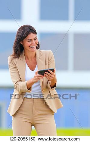 Business woman with smartphone in business center. San Sebastian Technology Park. Donostia. Gipuzkoa. Basque Country. Spain. View Large Photo Image Stock Image - Business woman with smartphone in business center. San Sebastian Technology Park. Donostia. Gipuzkoa. Basque Country. Spain.. Fotosearch