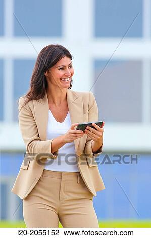 Business woman with smartphone in business center. San Sebastian Technology Park. Donostia. Gipuzkoa. Basque Country. Spain. View Large Photo Image Stock Image - Business woman with smartphone in business center. San Sebastian Technology Park. Donostia. Gipuzkoa. Basque Country. Spain.. Fotosearch