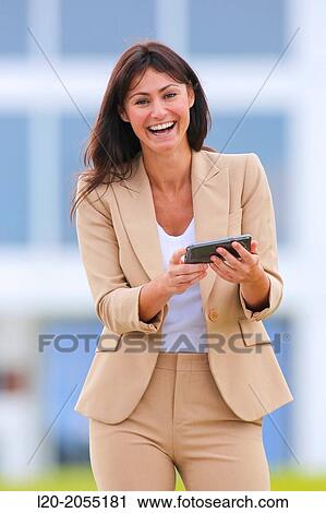 Business woman with smartphone in business center. San Sebastian Technology Park. Donostia. Gipuzkoa. Basque Country. Spain. View Large Photo Image Stock Image - Business woman with smartphone in business center. San Sebastian Technology Park. Donostia. Gipuzkoa. Basque Country. Spain.. Fotosearch