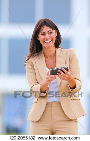 Business woman with smartphone in business center. San Sebastian Technology Park. Donostia. Gipuzkoa. Basque Country. Spain. View Large Photo Image Stock Image - Business woman with smartphone in business center. San Sebastian Technology Park. Donostia. Gipuzkoa. Basque Country. Spain.. Fotosearch