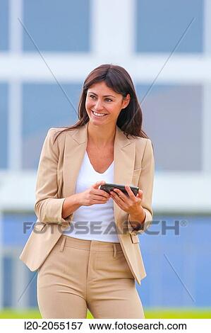 Business woman with smartphone in business center. San Sebastian Technology Park. Donostia. Gipuzkoa. Basque Country. Spain. View Large Photo Image Stock Photo - Business woman with smartphone in business center. San Sebastian Technology Park. Donostia. Gipuzkoa. Basque Country. Spain.. Fotosearch