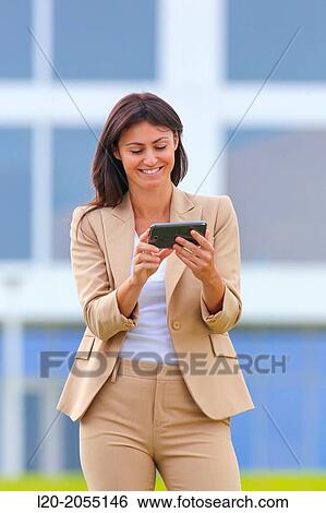 Business woman with smartphone in business center. San Sebastian Technology Park. Donostia. Gipuzkoa. Basque Country. Spain. View Large Photo Image Stock Photograph - Business woman with smartphone in business center. San Sebastian Technology Park. Donostia. Gipuzkoa. Basque Country. Spain.. Fotosearch