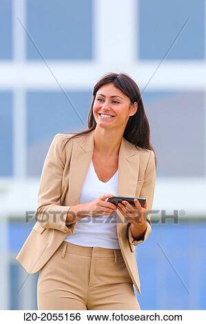 Business woman with smartphone in business center. San Sebastian Technology Park. Donostia. Gipuzkoa. Basque Country. Spain. View Large Photo Image Stock Photograph - Business woman with smartphone in business center. San Sebastian Technology Park. Donostia. Gipuzkoa. Basque Country. Spain.. Fotosearch