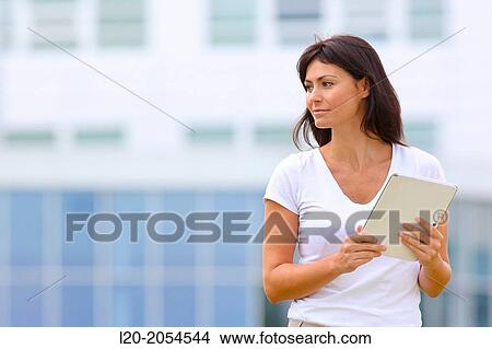Business woman with tablet in business center. San Sebastian Technology Park. Donostia. Gipuzkoa. Basque Country. Spain. View Large Photo Image Picture - Business woman with tablet in business center. San Sebastian Technology Park. Donostia. Gipuzkoa. Basque Country. Spain.. Fotosearch