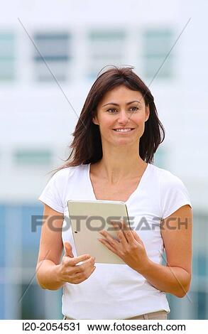 Stock Image - Business woman with tablet in business center. San Sebastian Technology Park. Donostia. Gipuzkoa. Basque Country. Spain.. Fotosearch