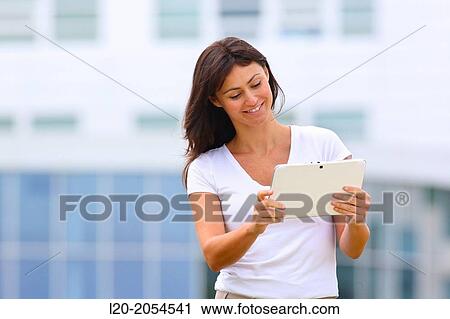 Business woman with tablet in business center. San Sebastian Technology Park. Donostia. Gipuzkoa. Basque Country. Spain. View Large Photo Image Stock Image - Business woman with tablet in business center. San Sebastian Technology Park. Donostia. Gipuzkoa. Basque Country. Spain.. Fotosearch