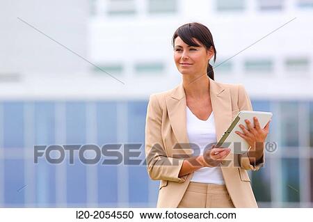 Business woman with tablet in business center. San Sebastian Technology Park. Donostia. Gipuzkoa. Basque Country. Spain. View Large Photo Image Stock Image - Business woman with tablet in business center. San Sebastian Technology Park. Donostia. Gipuzkoa. Basque Country. Spain.. Fotosearch