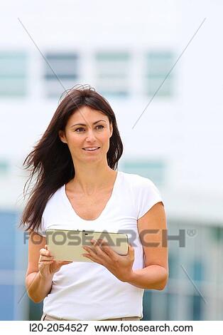 Business woman with tablet in business center. San Sebastian Technology Park. Donostia. Gipuzkoa. Basque Country. Spain. View Large Photo Image Stock Photo - Business woman with tablet in business center. San Sebastian Technology Park. Donostia. Gipuzkoa. Basque Country. Spain.. Fotosearch