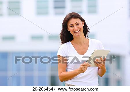 Business woman with tablet in business center. San Sebastian Technology Park. Donostia. Gipuzkoa. Basque Country. Spain. View Large Photo Image Stock Photo - Business woman with tablet in business center. San Sebastian Technology Park. Donostia. Gipuzkoa. Basque Country. Spain.. Fotosearch