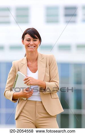 Business woman with tablet in business center. San Sebastian Technology Park. Donostia. Gipuzkoa. Basque Country. Spain. View Large Photo Image Stock Photo - Business woman with tablet in business center. San Sebastian Technology Park. Donostia. Gipuzkoa. Basque Country. Spain.. Fotosearch