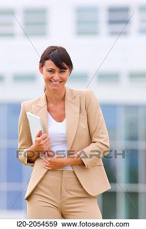 Stock Photo - Business woman with tablet in business center. San Sebastian Technology Park. Donostia. Gipuzkoa. Basque Country. Spain.. Fotosearch