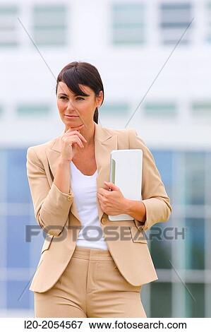 Stock Photo - Business woman with tablet in business center. San Sebastian Technology Park. Donostia. Gipuzkoa. Basque Country. Spain.. Fotosearch