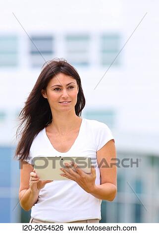 Business woman with tablet in business center. San Sebastian Technology Park. Donostia. Gipuzkoa. Basque Country. Spain. View Large Photo Image Stock Photograph - Business woman with tablet in business center. San Sebastian Technology Park. Donostia. Gipuzkoa. Basque Country. Spain.. Fotosearch