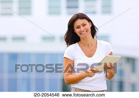 Business woman with tablet in business center. San Sebastian Technology Park. Donostia. Gipuzkoa. Basque Country. Spain. View Large Photo Image Stock Photograph - Business woman with tablet in business center. San Sebastian Technology Park. Donostia. Gipuzkoa. Basque Country. Spain.. Fotosearch