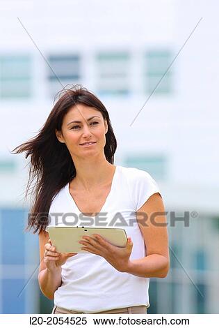 Business woman with tablet in business center. San Sebastian Technology Park. Donostia. Gipuzkoa. Basque Country. Spain. View Large Photo Image Stock Photography - Business woman with tablet in business center. San Sebastian Technology Park. Donostia. Gipuzkoa. Basque Country. Spain.. Fotosearch