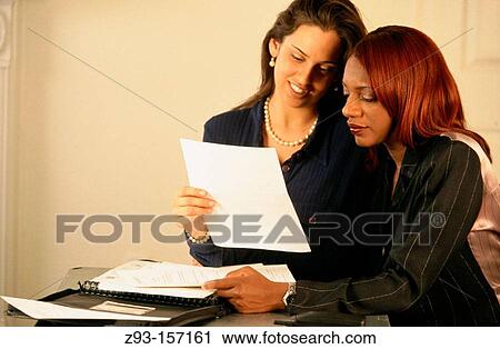 Stock Image - Business women in office. Fotosearch