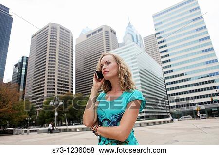 Business women talking by cellphone in Center City. Philadelphia. Pennsylvania. USA View Large Photo Image Stock Photo - Business women talking by cellphone in Center City. Philadelphia. Pennsylvania. USA. Fotosearch