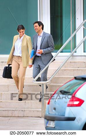 Businessman and business woman in business center. San Sebastian Technology Park. Donostia. Gipuzkoa. Basque Country. Spain. View Large Photo Image Stock Photo - Businessman and business woman in business center. San Sebastian Technology Park. Donostia. Gipuzkoa. Basque Country. Spain.. Fotosearch