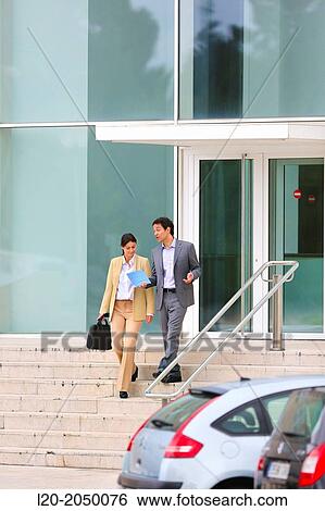 Businessman and business woman in business center. San Sebastian Technology Park. Donostia. Gipuzkoa. Basque Country. Spain. View Large Photo Image Stock Photograph - Businessman and business woman in business center. San Sebastian Technology Park. Donostia. Gipuzkoa. Basque Country. Spain.. Fotosearch
