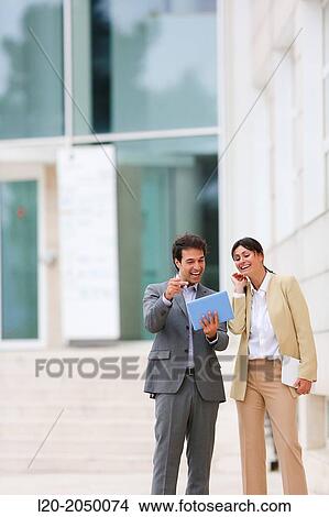 Picture - Businessman and business woman with tablet in business center. San Sebastian Technology Park. Donostia. Gipuzkoa. Basque Country. Spain.. Fotosearch