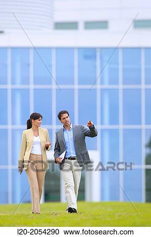 Businessman and businesswoman walking in business center. San Sebastian Technology Park. Donostia. Gipuzkoa. Basque Country. Spain. View Large Photo Image Stock Image - Businessman and businesswoman walking in business center. San Sebastian Technology Park. Donostia. Gipuzkoa. Basque Country. Spain.. Fotosearch