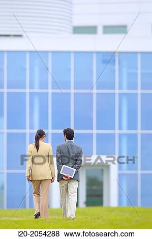 Businessman and businesswoman walking in business center. San Sebastian Technology Park. Donostia. Gipuzkoa. Basque Country. Spain. View Large Photo Image Stock Photo - Businessman and businesswoman walking in business center. San Sebastian Technology Park. Donostia. Gipuzkoa. Basque Country. Spain.. Fotosearch