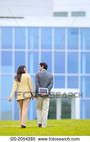 Businessman and businesswoman walking in business center. San Sebastian Technology Park. Donostia. Gipuzkoa. Basque Country. Spain. View Large Photo Image Stock Photography - Businessman and businesswoman walking in business center. San Sebastian Technology Park. Donostia. Gipuzkoa. Basque Country. Spain.. Fotosearch