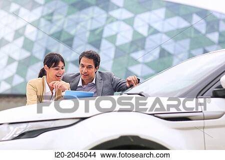 Businessman and businesswoman with tablet in parking business center. San Sebastian Technology Park. Donostia. Gipuzkoa. Basque Country. Spain. View Large Photo Image Picture - Businessman and businesswoman with tablet in parking business center. San Sebastian Technology Park. Donostia. Gipuzkoa. Basque Country. Spain.. Fotosearch