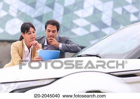 Businessman and businesswoman with tablet in parking business center. San Sebastian Technology Park. Donostia. Gipuzkoa. Basque Country. Spain. View Large Photo Image Stock Image - Businessman and businesswoman with tablet in parking business center. San Sebastian Technology Park. Donostia. Gipuzkoa. Basque Country. Spain.. Fotosearch