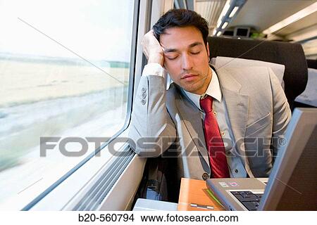 Businessman asleep. Passenger. AVE, Tren de Alta Velocidad, Zaragoza, Arag? n. Spain. View Large Photo Image Picture - Businessman asleep. Passenger. AVE, Tren de Alta Velocidad, Zaragoza, Arag? n. Spain.. Fotosearch