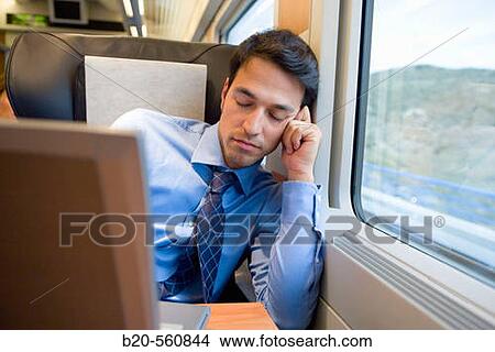 Businessman asleep. Passenger. AVE, Tren de Alta Velocidad, Zaragoza, Arag? n. Spain. View Large Photo Image Picture - Businessman asleep. Passenger. AVE, Tren de Alta Velocidad, Zaragoza, Arag? n. Spain.. Fotosearch