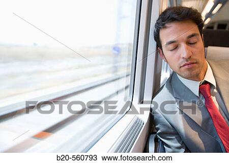Businessman asleep. Passenger. AVE, Tren de Alta Velocidad, Zaragoza, Arag? n. Spain. View Large Photo Image Stock Image - Businessman asleep. Passenger. AVE, Tren de Alta Velocidad, Zaragoza, Arag? n. Spain.. Fotosearch