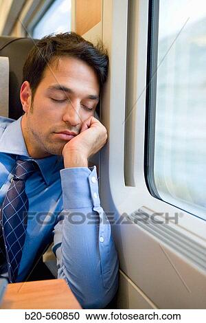 Businessman asleep. Passenger. AVE, Tren de Alta Velocidad, Zaragoza, Arag? n. Spain. View Large Photo Image Stock Image - Businessman asleep. Passenger. AVE, Tren de Alta Velocidad, Zaragoza, Arag? n. Spain.. Fotosearch