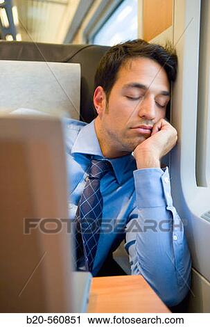Businessman asleep. Passenger. AVE, Tren de Alta Velocidad, Zaragoza, Arag? n. Spain. View Large Photo Image Stock Image - Businessman asleep. Passenger. AVE, Tren de Alta Velocidad, Zaragoza, Arag? n. Spain.. Fotosearch