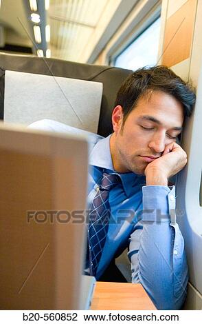 Businessman asleep. Passenger. AVE, Tren de Alta Velocidad, Zaragoza, Arag? n. Spain. View Large Photo Image Stock Image - Businessman asleep. Passenger. AVE, Tren de Alta Velocidad, Zaragoza, Arag? n. Spain.. Fotosearch