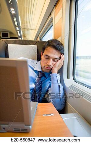 Businessman asleep. Passenger. AVE, Tren de Alta Velocidad, Zaragoza, Arag? n. Spain. View Large Photo Image Stock Photo - Businessman asleep. Passenger. AVE, Tren de Alta Velocidad, Zaragoza, Arag? n. Spain.. Fotosearch
