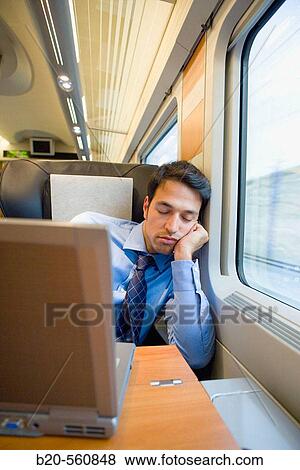 Businessman asleep. Passenger. AVE, Tren de Alta Velocidad, Zaragoza, Arag? n. Spain. View Large Photo Image Stock Photo - Businessman asleep. Passenger. AVE, Tren de Alta Velocidad, Zaragoza, Arag? n. Spain.. Fotosearch