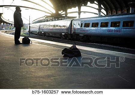 businessman at train station View Large Photo Image Stock Photo - businessman at train station. Fotosearch
